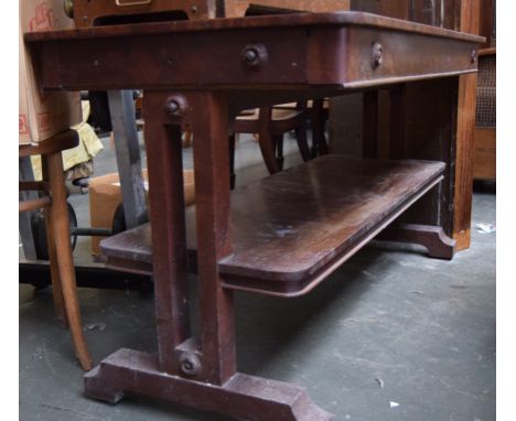 An early victorian mahogany two tiered buffet table with broadly cross banded top above an open shelf, the square section app