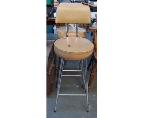 Two vintage bar stools stools with cream leatherette seats