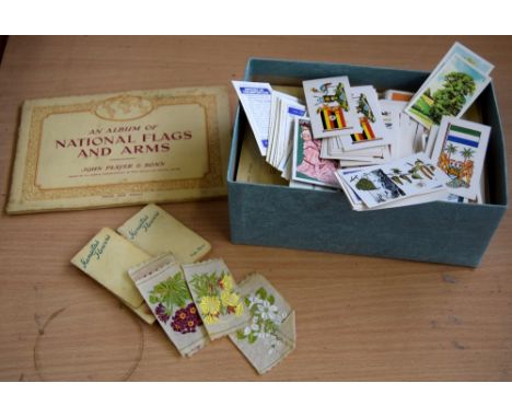 A collection of cigarette and tea card albums from John Player and Brooke Bond, together with a quantity of loose Brooke Bond