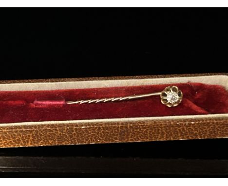 Yellow metal stick pin set with diamond approx. diamond size 3/16 carat 
