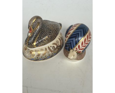 Royal crown derby black swan with gold stopper together with a royal crown derby snail with ceramic stopper 