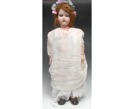 An Armand &amp; Marseille (Germany) bisque head and ball jointed painted composition bodied doll, light brown wig on pate, we
