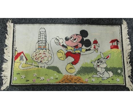 Disney - a vintage character rug, colourfully worked with Mickey Mouse and a space rocket, 52cm x 89cm 