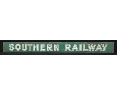 Railwayana - a Southern Railway rectangular shaped enamel poster board heading, raised white sunshine lettering on green grou