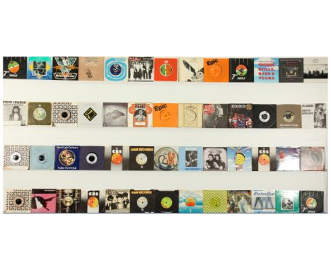 A collection of 1970's Rock 7" Singles. Includes artists: 10cc, Todd Rundgren, Steve Earle, Crosby Stills and Nash, ToTo, Ele