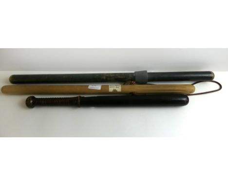 A collection of three assorted police truncheons 20th CenturyFirst from Spain and Basque police 60cm truncheon with fluted gr