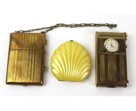 Three vintage powder compacts
To include Elgin Clamshell finished in yellow and 14ct gold-plate, length 7cm, German novelty c