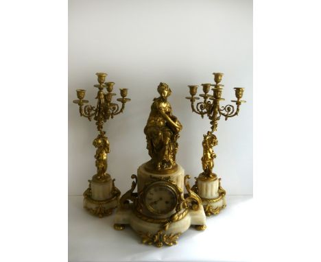 An impressive late 19th/early 20th Century Continental gilt metal and marble three piece clock garniture of classical form 
C