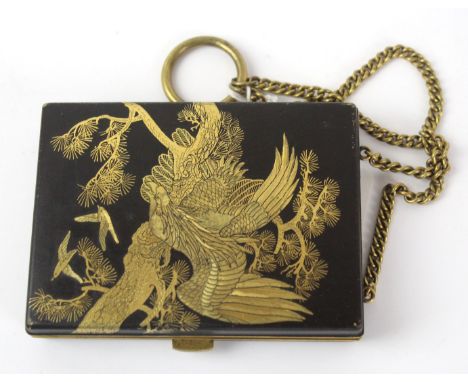 A fine quality Japanese mixed metal compact
Depicting gilt mythical birds on a black ground, the hinged cover enclosing mirro