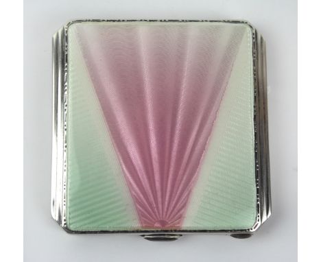 An Art Deco sterling silver and guilloche enamel powder compact
Of square form, with two tone pink and green sunburst design,