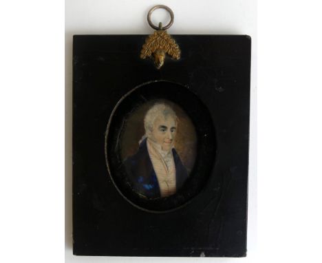 A Georgian portrait miniature of a gent in blue jacketInset into an ebonised frame, image size 6x5cm 