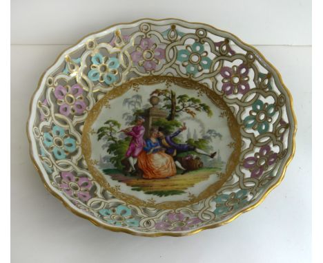 A large Meissen hard paste porcelain hand painted bowl
Of circular form, having pierced border surrounding a central panel de