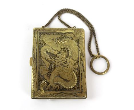 A good quality Japanese gilt metal vanity carryall case
The hinged cover enclosing mirror, dime and dollar and red silk inter