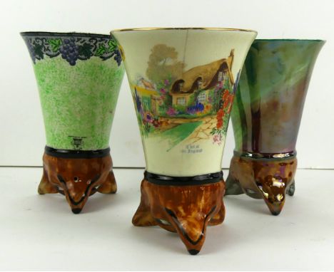 Three early 20th Century Maling stirrup cupsEach of different designs, one 'A bit of old England', height 14cm    CONDITION R