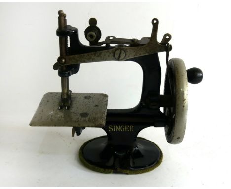 Singer Manufacturing Co - a miniature cast iron manual sewing machine