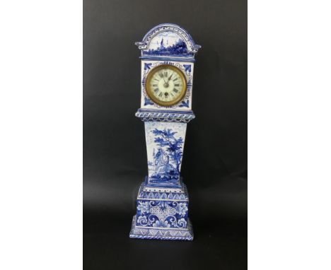 A late 19th Century Delft tin glazed porcelain mantel clockDecorated with figures in landscape scene, with floral decoration,