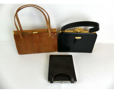 Three vintage ladies handbags
Two of typical form, the black example with fitted interior containing purse, compact, comb, li