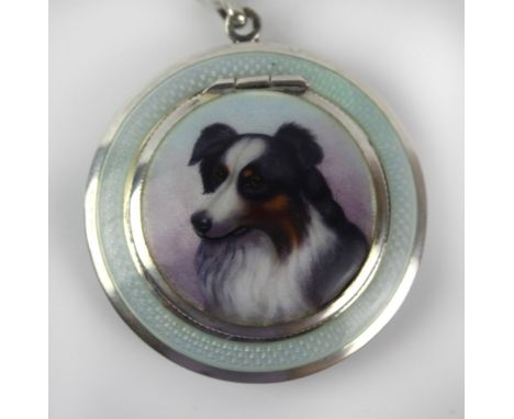 A fine Art Deco white metal and guilloche enamel powder compact
The hinged cover decoration with a portrait of a Collie dog s