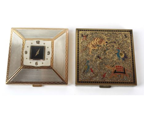 Two vintage powder compacts
To include rare Amere travelling example with hinged clock, having silvered Arabic numerals, diam