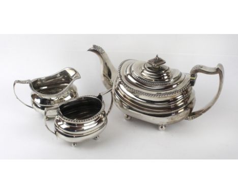 A George III silver tea set To include a teapot and milk jug, together with a 1930s silver sugar pot, all of oval rounded for