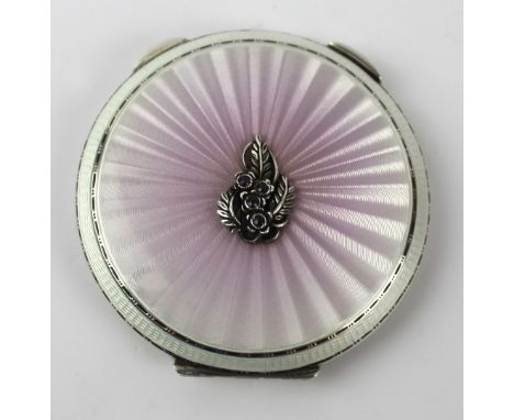 A good quality Art Deco style hallmarked silver and guilloche enamel powder compact
Of circular form, with applied white meta