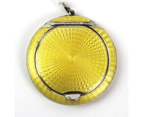 A George V hallmarked silver and guilloche enamel powder compact
Of circular form, having yellow enamelled decoration, made b