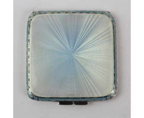 A George VI hallmarked silver and guilloche enamel powder compact
Of square form, having light blue sunray enamelled decorati
