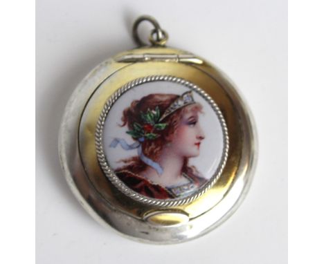 A George V hallmarked silver circular compact
With applied portrait panel depicting a classical lady wearing headdress, Birmi