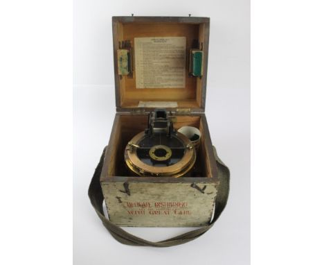 A wooden cased gimble mounted azimuth circle no 4 compass, WWIIWith War Department marks, instruction leaflet, housed in a gr