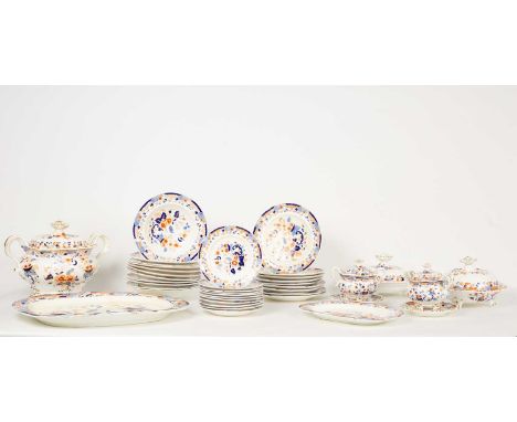 A Staffordshire porcelain part dinner service, circa 1850, printed in blue and iron-red with a light floral design, comprisin