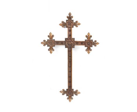 A Gothic revival oak crucifix, the cross with fleur-de-lys details to the terminals, highlighted in gilt, 95cm high x 61cm wi