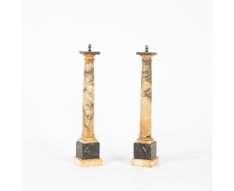 A pair of 19th Century marble and alabaster columns, of Grand Tour type, each alabaster column on a portoro marble plinth, co
