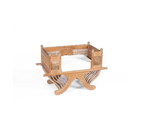 An elephant 'Howdah' saddle chair with cushion, 108cm wide, 59cm deep, 72cm high