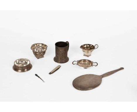 A small quantity of silver including a Victorian Christening mug, London 1872, 8.5cm high, a tea-strainer on stand, Birmingha