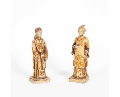 Pair of Chinese yellow/cream glazed ceramic figures, Modern, on square bases, 31cm high