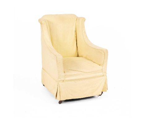 A Victorian upholstered armchair with a slip cover, the short wing back above square downswept arms and an upholstered seat, 