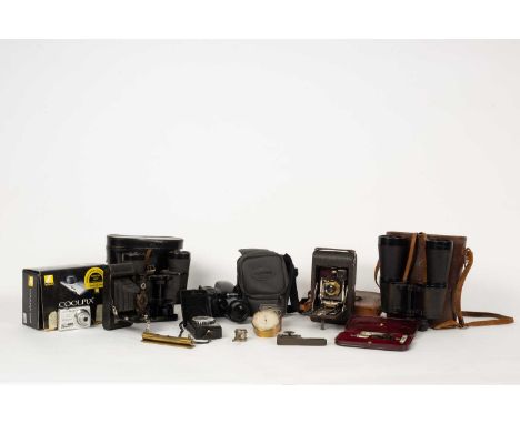 A collection of cameras and scientific equipment to include a Negretti & Zambra pocket altimeter numbered 12017 in a brass ca