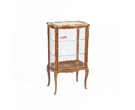 A Victorian rosewood and gilt metal mounted vitrine, of serpentine outline with glass sides enclosed by a glazed door and on 