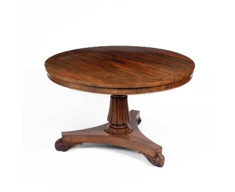 A Regency rosewood tilt-top breakfast table on a reeded column and triform base with scroll feet, 115cm diameter, 70cm high  