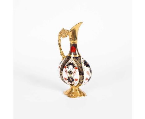 A Royal Crown Derby ewer in the 1128 patten, 25.5cm highThere are three hairline cracks to the handle. Images supplied. It is