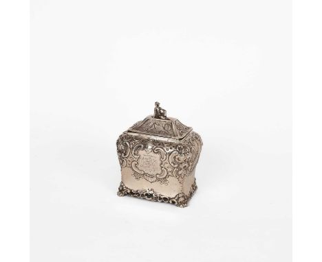 A George III silver tea caddy, John Emes, London 1802, of oblong shape, the hinged cover with seated figure finial, the sides