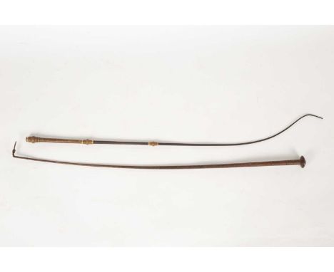 A Swaine &amp; Adeney leather riding crop and a Swaine Slucock &amp; Swaine riding crop with gold coloured mounts (2)