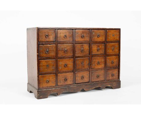 A Korean apothecary chest, fitted with five rows of four drawers, the drawers with incised characters and loop handles, 63cm 