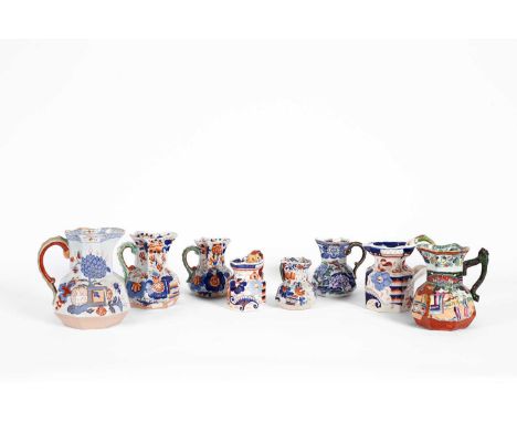 Eight Ironstone jugs, to include Masons, varying sizes, the largest 19.5cm high, the smallest 11cm high