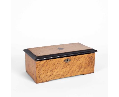 A 19th Century Swiss music box, playing four airs, in a burr walnut case, 28.5cm wide, 15cm deep, 10cm highCase fair but has 