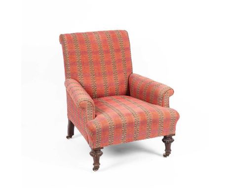 A Victorian upholstered armchair, the turned front legs with beaded decoration and white ceramic castors, 71cm wide, 89cm hig
