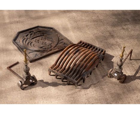 A 17th Century style cast iron fire back cast with palm leaves flanking a crowned shield with three fleurs-de-lis, dated 1635