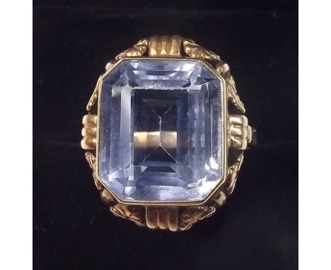 A 14 carat gold ring set topaz in decorative surround - size M 1/2