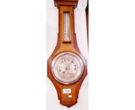 A mahogany and walnut barometer/thermometer retailed by Picketts Ltd