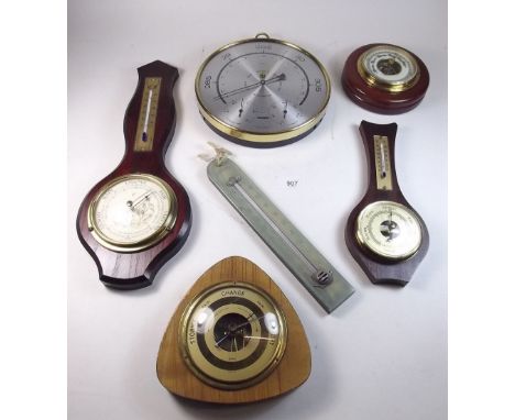 Five various vintage barometers and a thermometer